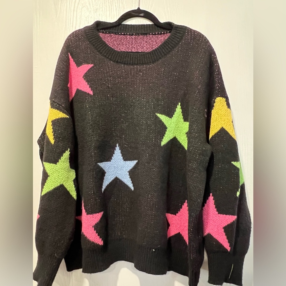 Black sweater with multi-coloured stars